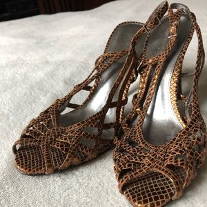Calvin Klein, bronze sandals with 2” heel.